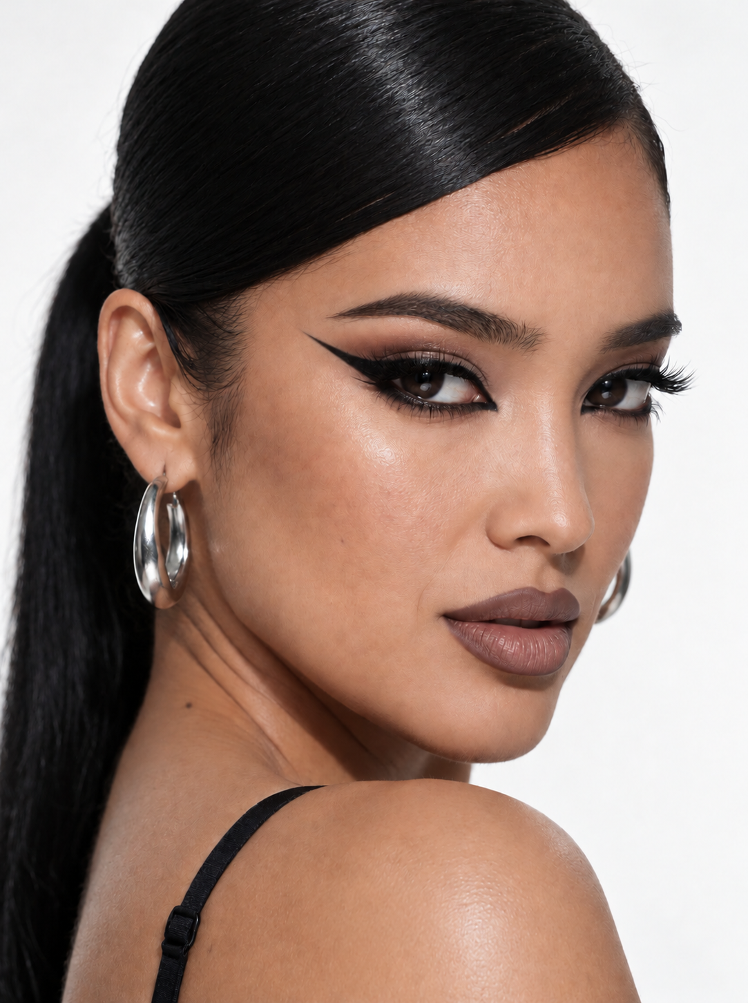 Melissa B. with silver hoop earrings